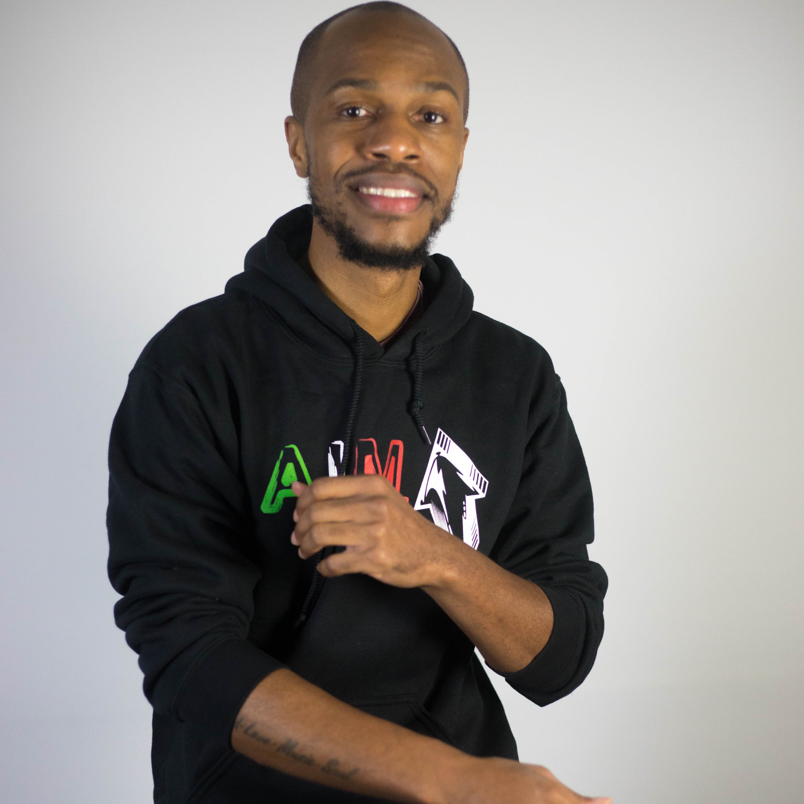 Black aim hoodie overcoming by faith ministries